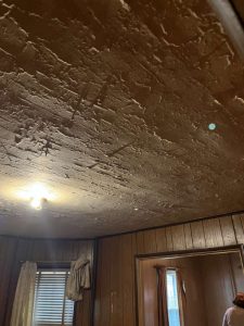 Before: Dining room ceiling water damage.