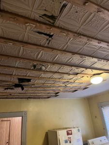 Before: Kitchen ceiling with water damage.